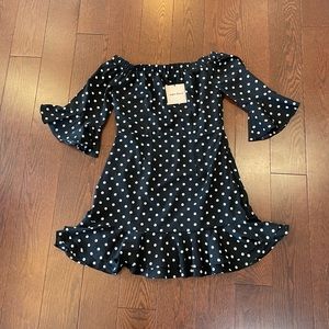 Pristine w/ tags. Black dress w/ white dots.